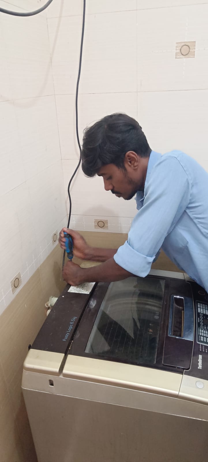 Technician Repairing Appliance